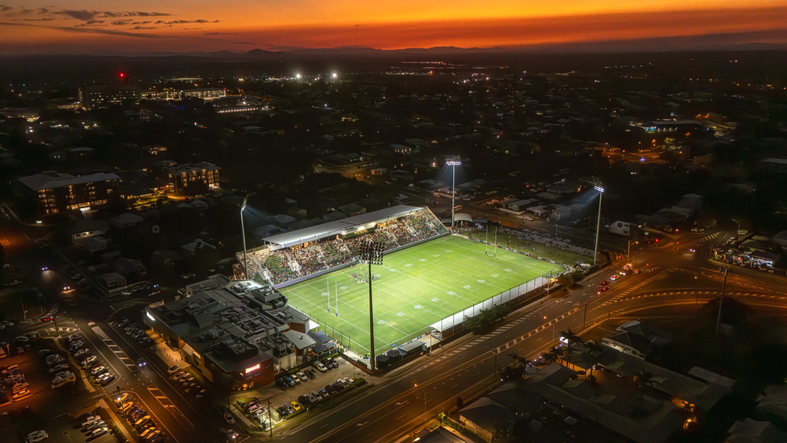 Aerial twilight view of the Capras' stadium and the surrounding Rockhampton city lights